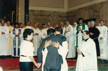 Father Andrew Carl Wisdom, O.P. embraces his father at his ordination in Rome.
