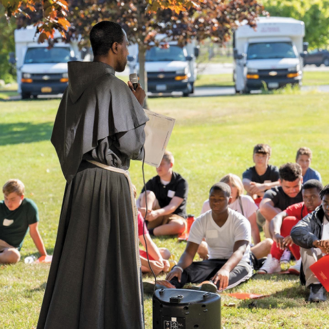 Brother Antonio Moualeu, O.F.M.Conv. leads a prayer meditation during a youth retreat.