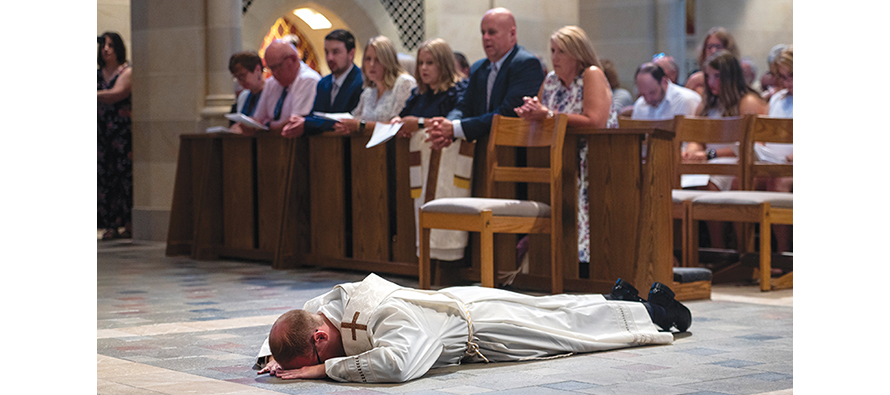 WHEN A MAN  is ordained, he lies prostrate on the floor as a symbol of giving over his entire life to service, as shown here in the Diocese of Rochester, New York.